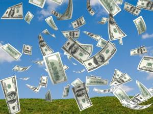 money falling in the sky and green grass background