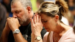 People pray during a vigil for the victims of a mass shooting in Las Vegas